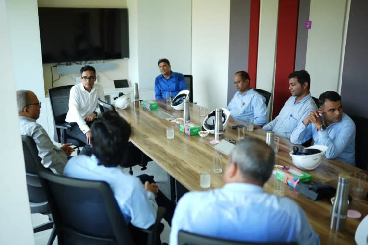 Team members collaborating during operations inside Aarti Industries industrial plant
