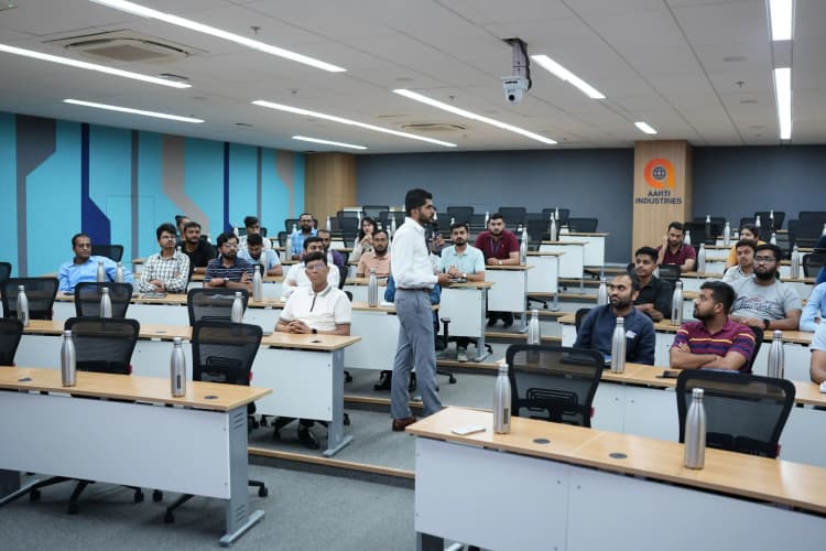 Safety-suited team working on machinery in Aarti Industries chemical processing unit