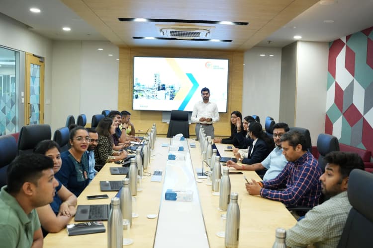 Employees gathered in group at Aarti Industries plant environment