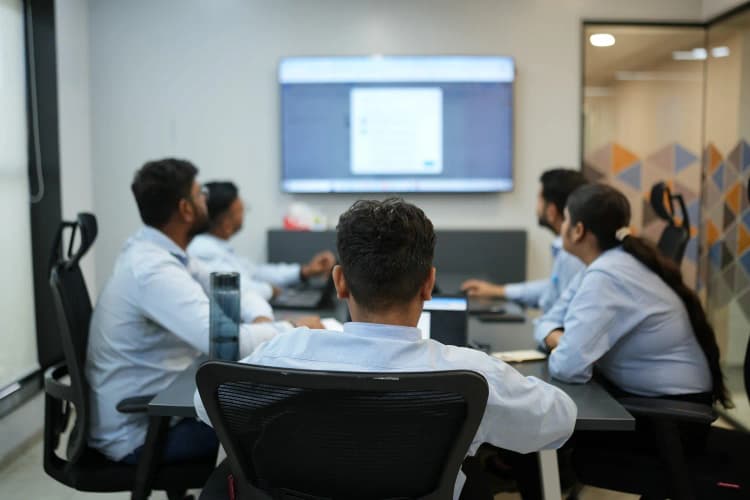 Team participating in workplace safety or operational session at Aarti Industries